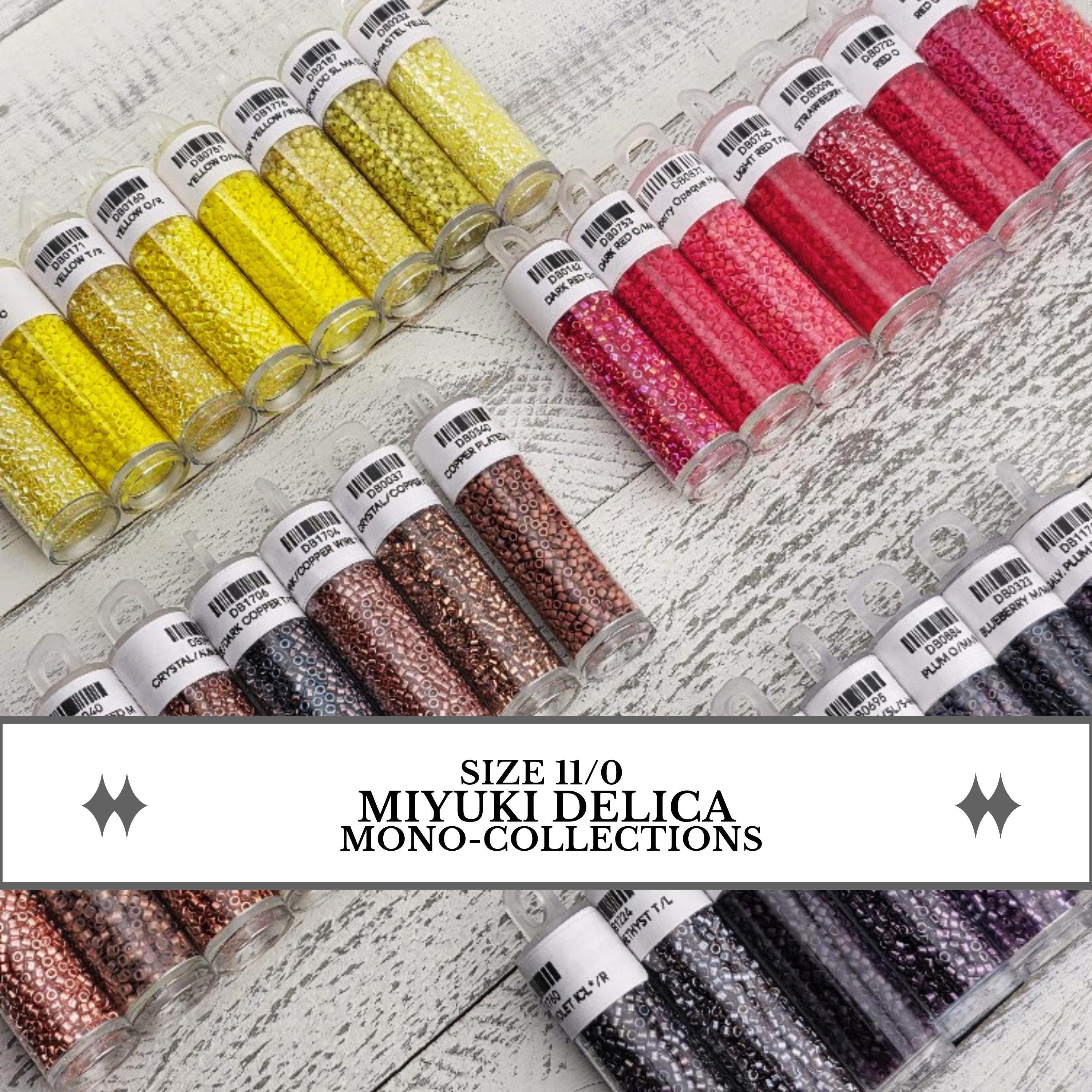 a collection of colorful beads in various sizes, arranged in rows on a wooden surface.