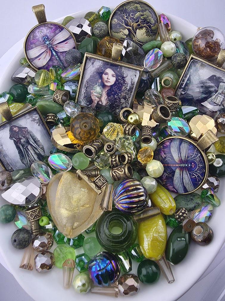 The image is a collage of various colorful beads, charms, and pendants, including gemstones, glass beads, and metal pieces, arranged on a white surface.