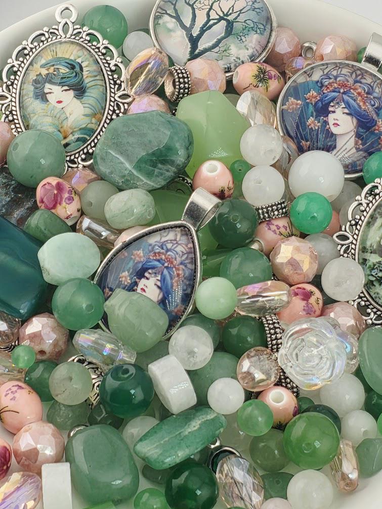 The image is a collage of various colorful beads, charms, and pendants, including gemstones and decorative elements.