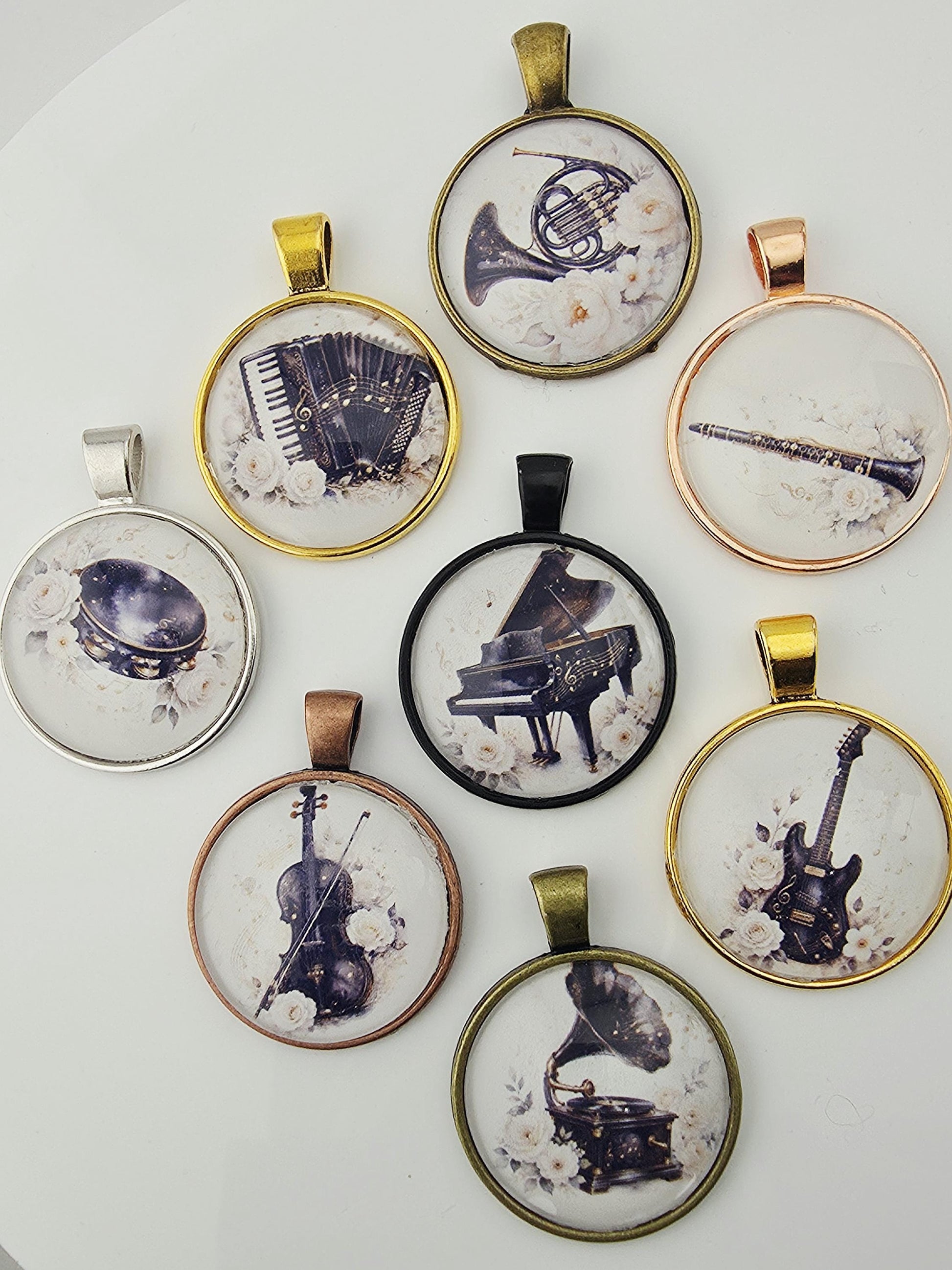nine pendants or charms, each featuring a different musical instrument. The pendants are arranged in a circular pattern, with each one displaying a different instrument, such as a trumpet, piano, and guitar.