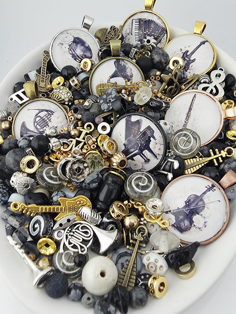 The image is a collage of various musical-themed objects, including pendants, charms, and beads, all arranged on a white surface.