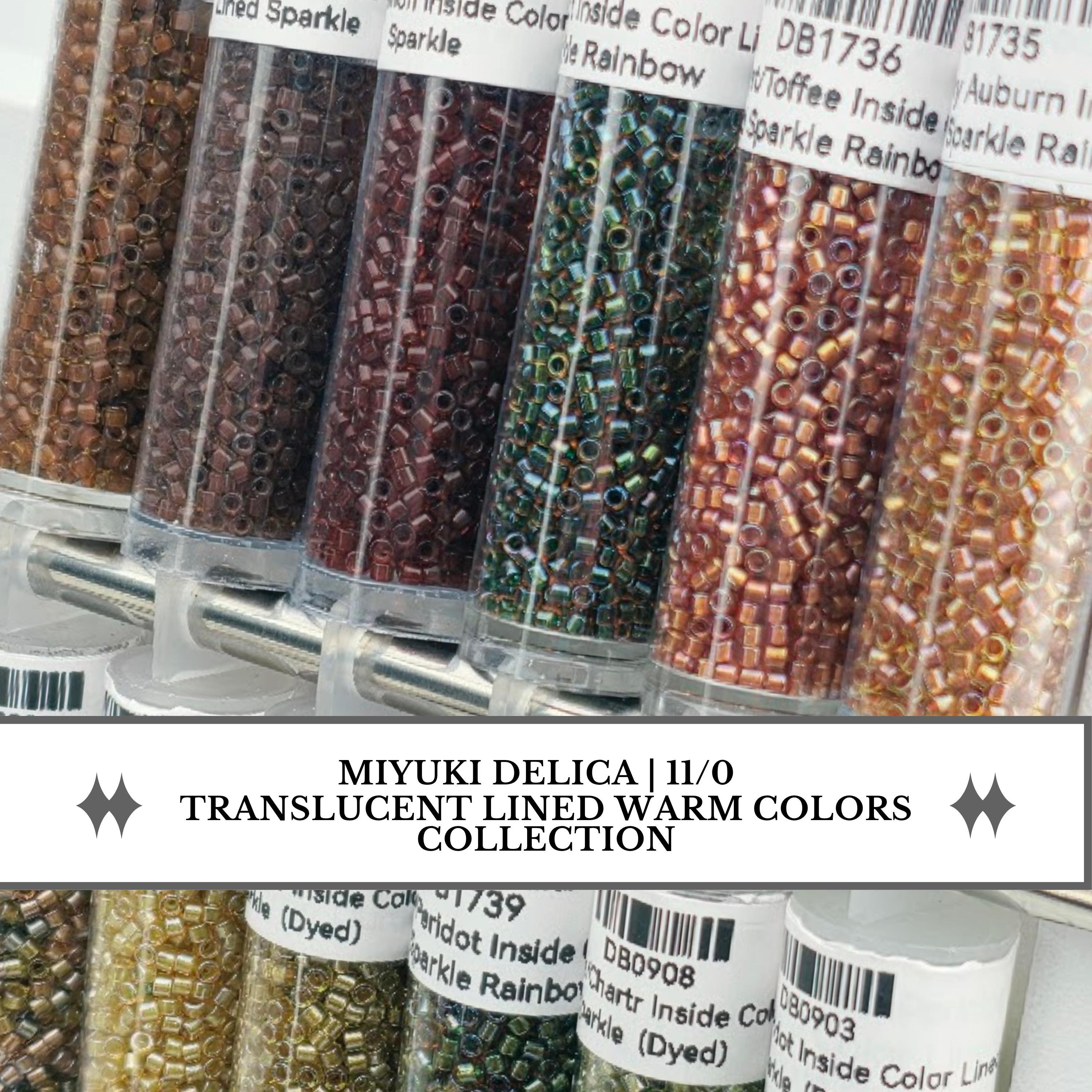 a collection of transparent lined warm colors, including brown, green, and orange beads, arranged in transparent containers.