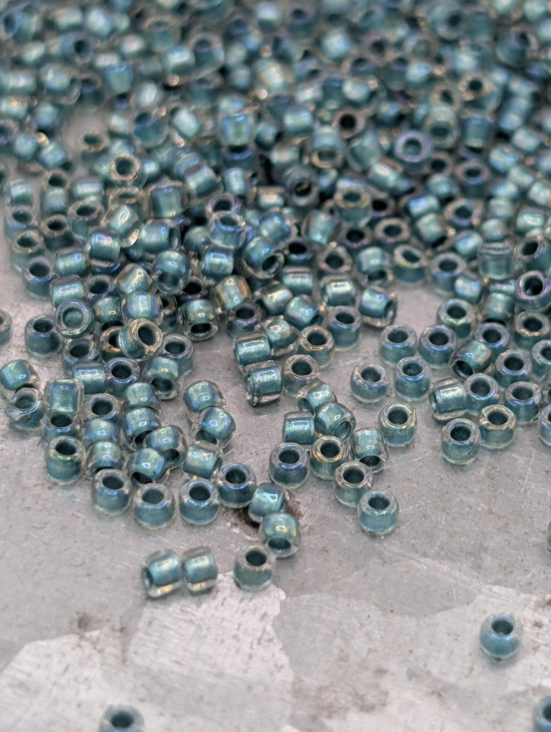 Inside-Color Rainbow Crystal/Teal-Lined Size 15/0 Toho Round 2.5" tube