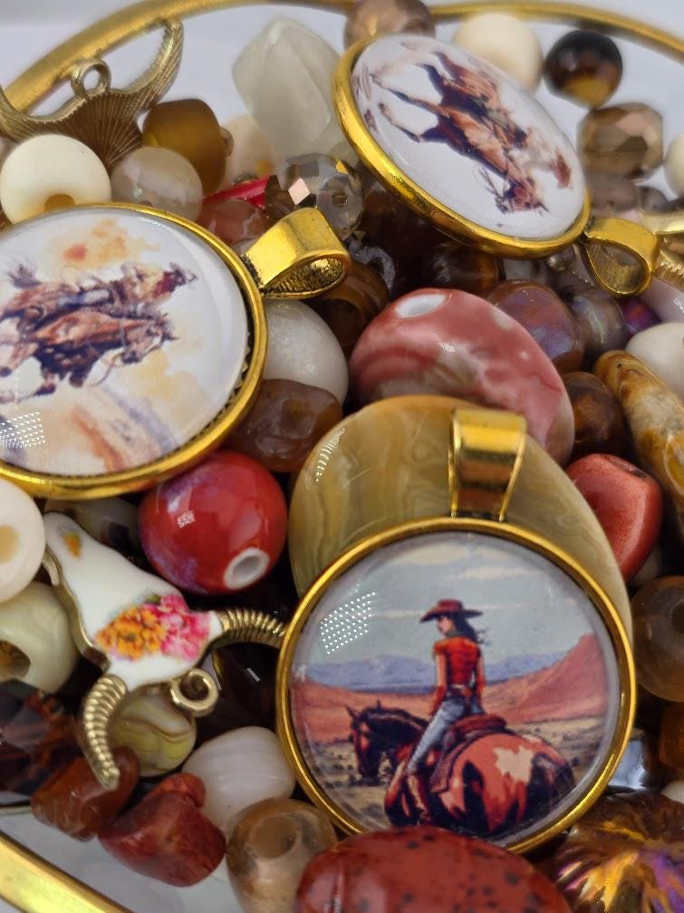 various decorative items, including pendants, beads, and a horse-themed charm. The pendants and charms feature images of horses and riders, creating a cohesive theme.