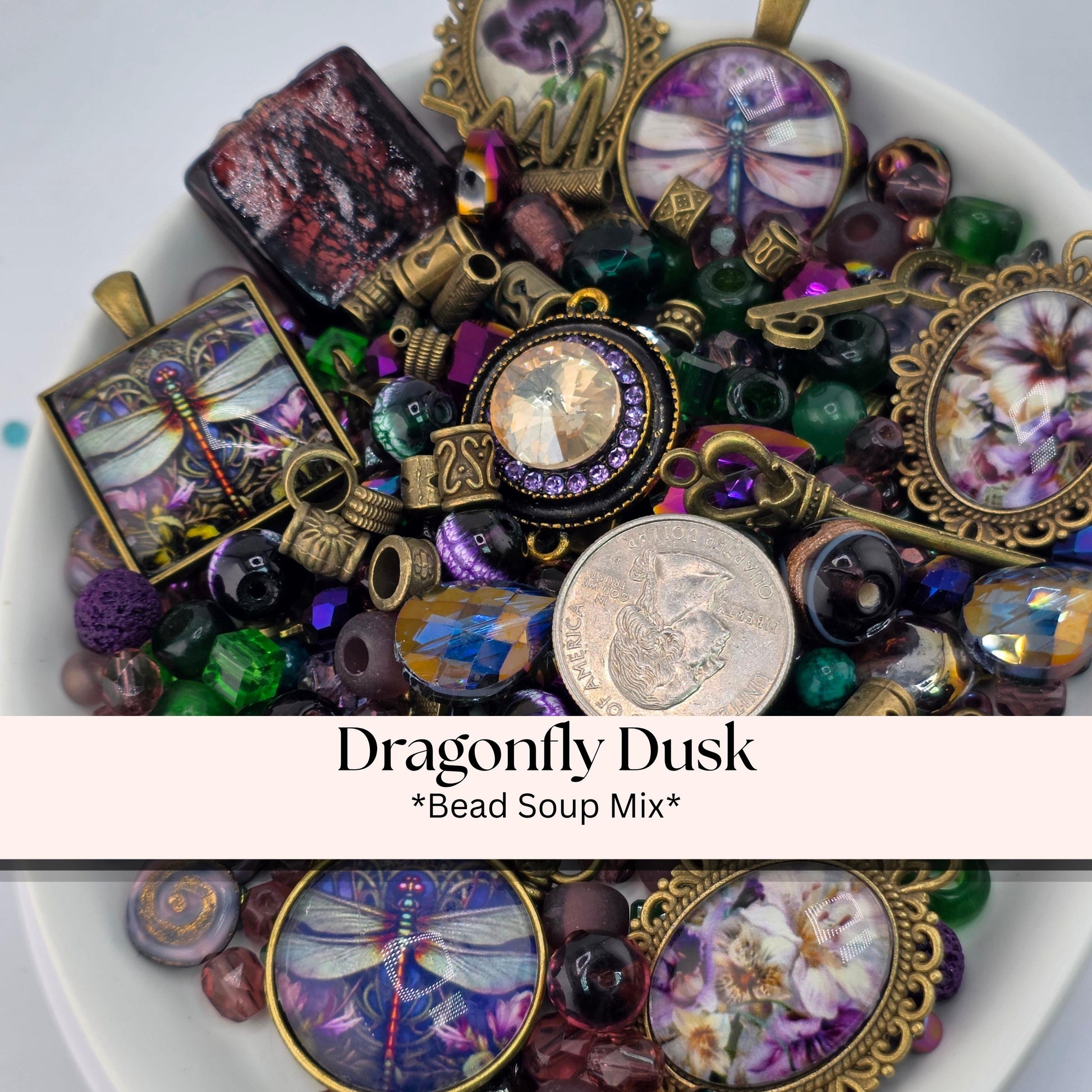 A collection of colorful beads, charms, and pendants, including a dragonfly design, arranged in a bowl.
