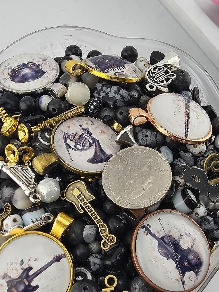 various objects, including a guitar, coins, and beads, all of which are part of a collection.