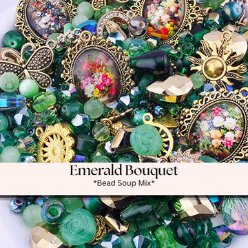 The image is a collage of various beads, charms, and other decorative elements, including a large ornate pendant, a floral design, and a sun motif. The text " Emerald Bouquet *Bead Soup Mix*" is displayed in the image.