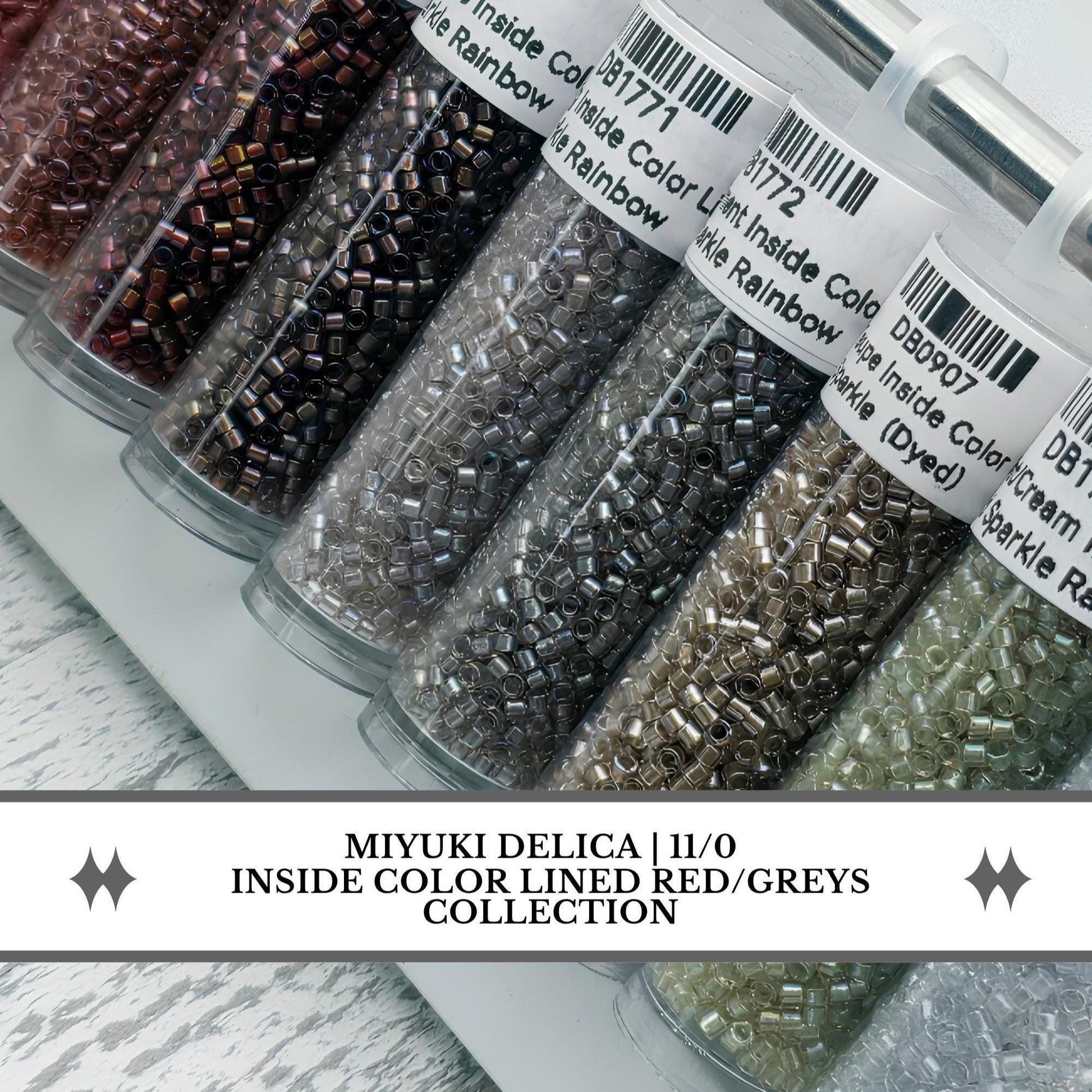 May include: A collection of Miyuki Delica 11/0 beads in red and grey tones, stored in clear cylindrical tubes. Each tube features a white label with a barcode and text including Inside Color Lined Red/Greys Collection and specific product codes.
