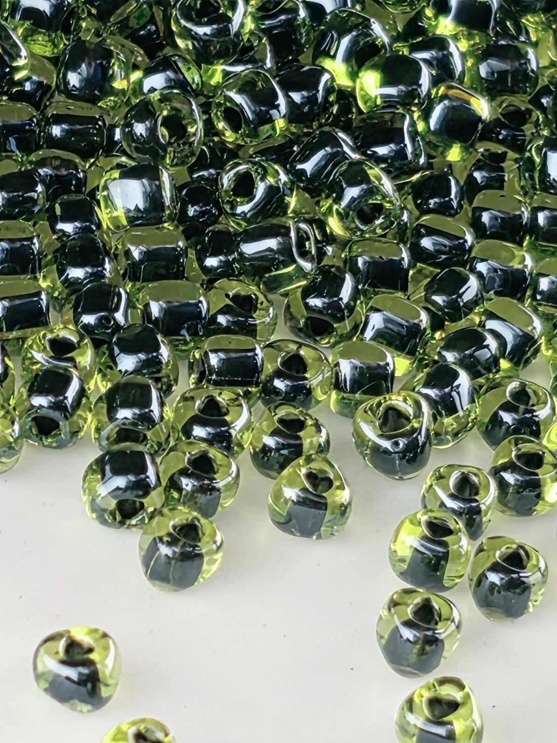 Peridot/Black Inside Color Lined Miyuki Triangle Size 8/0 (15g Pkg)