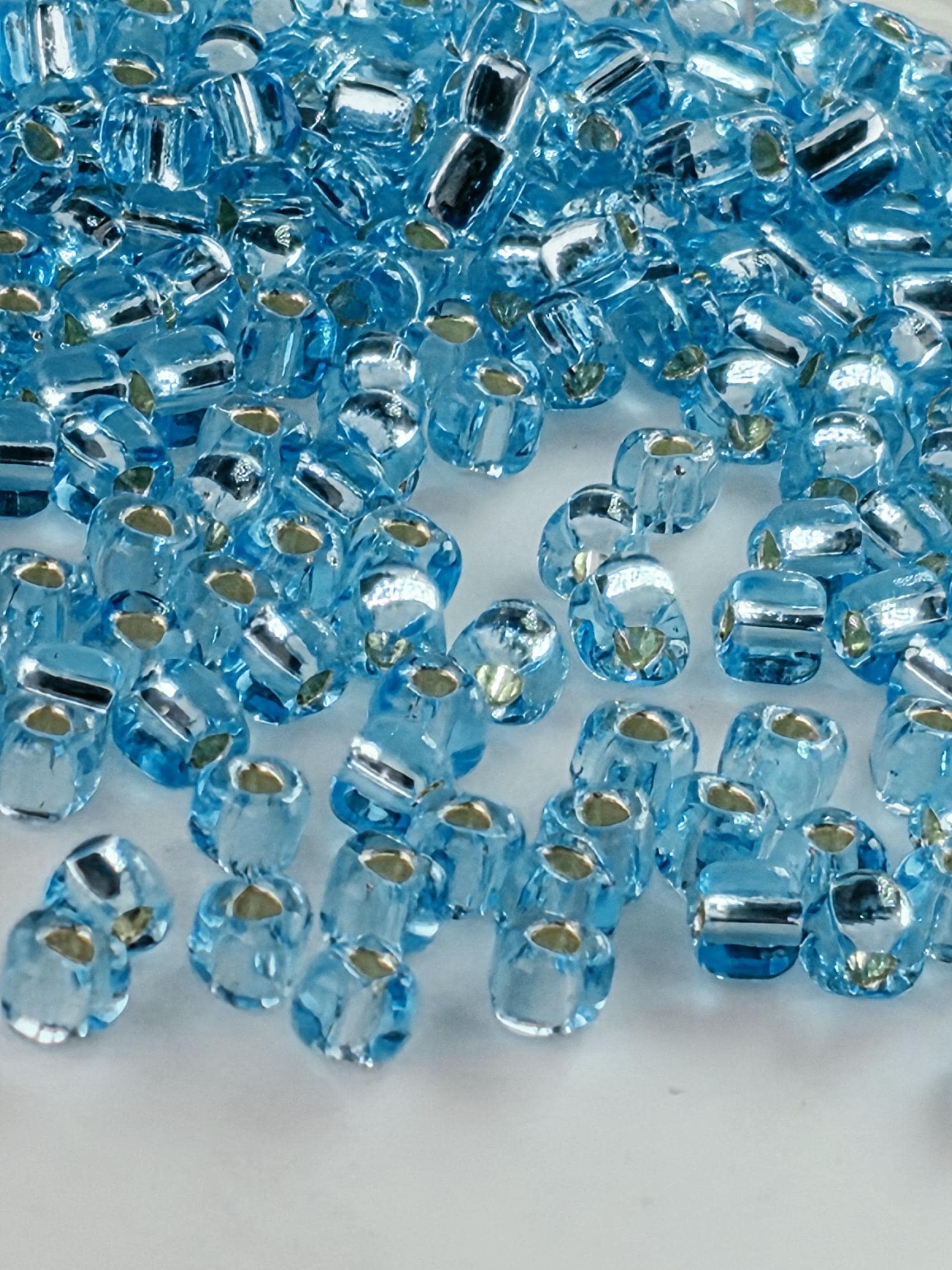 Blue Topaz Translucent Silver Lined Miyuki Triangle Size 8/0 (15g Pkg)