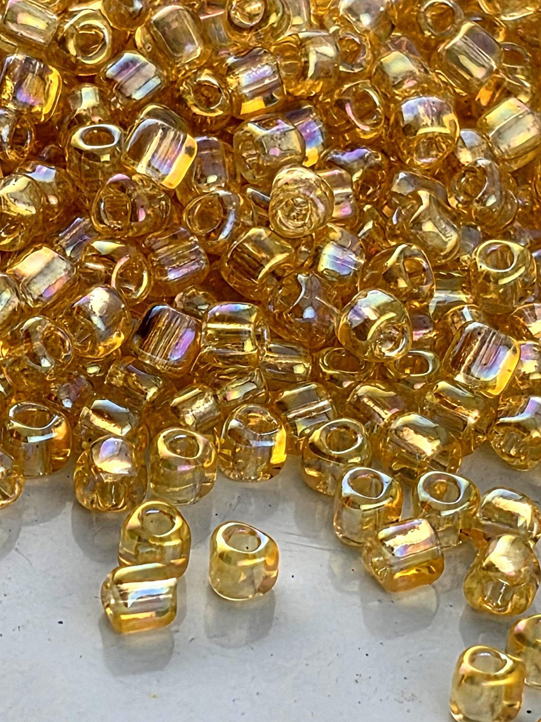 Light Gold Translucent Rainbow Miyuki Triangle Size 10/0 (15g Pkg)