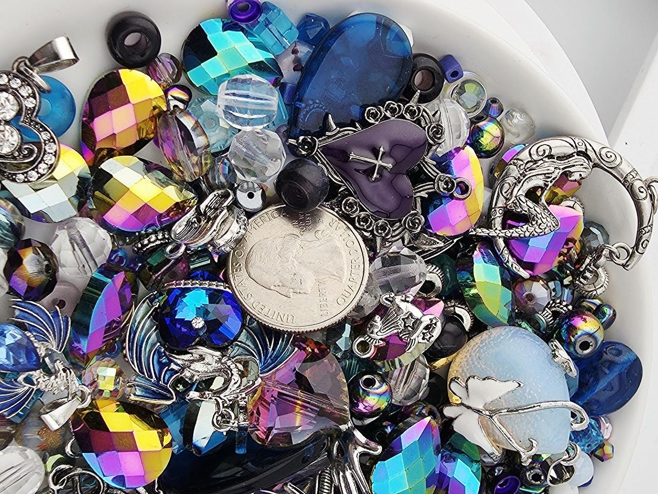 A bowl filled with a variety of colorful beads, charms, and other decorative items.