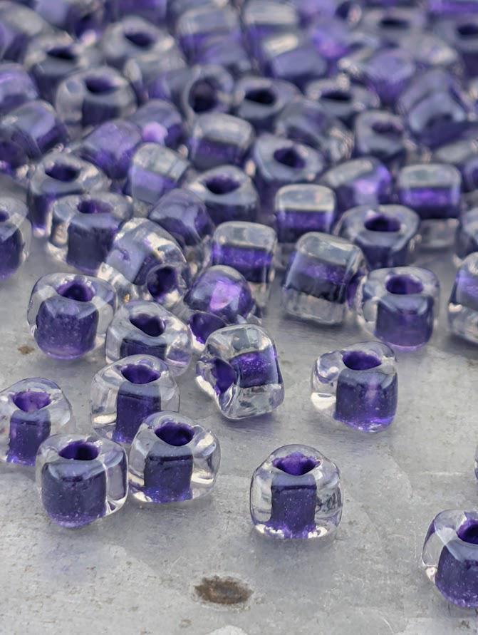 Crystal/Dark Purple Inside Color Lined Sparkle Miyuki Triangle Size 5/0 (15g Pkg)