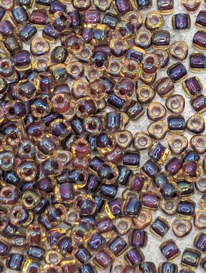 Amber/Amethyst Inside Color Lined Miyuki Triangle Size 8/0 (15g Pkg)