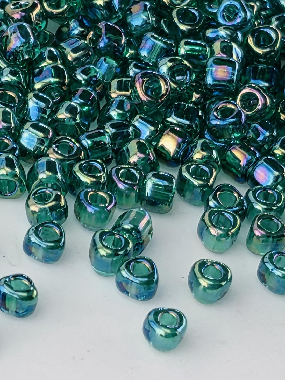 Medium Green Translucent Rainbow Miyuki Triangle Size 8/0 (15g Pkg)