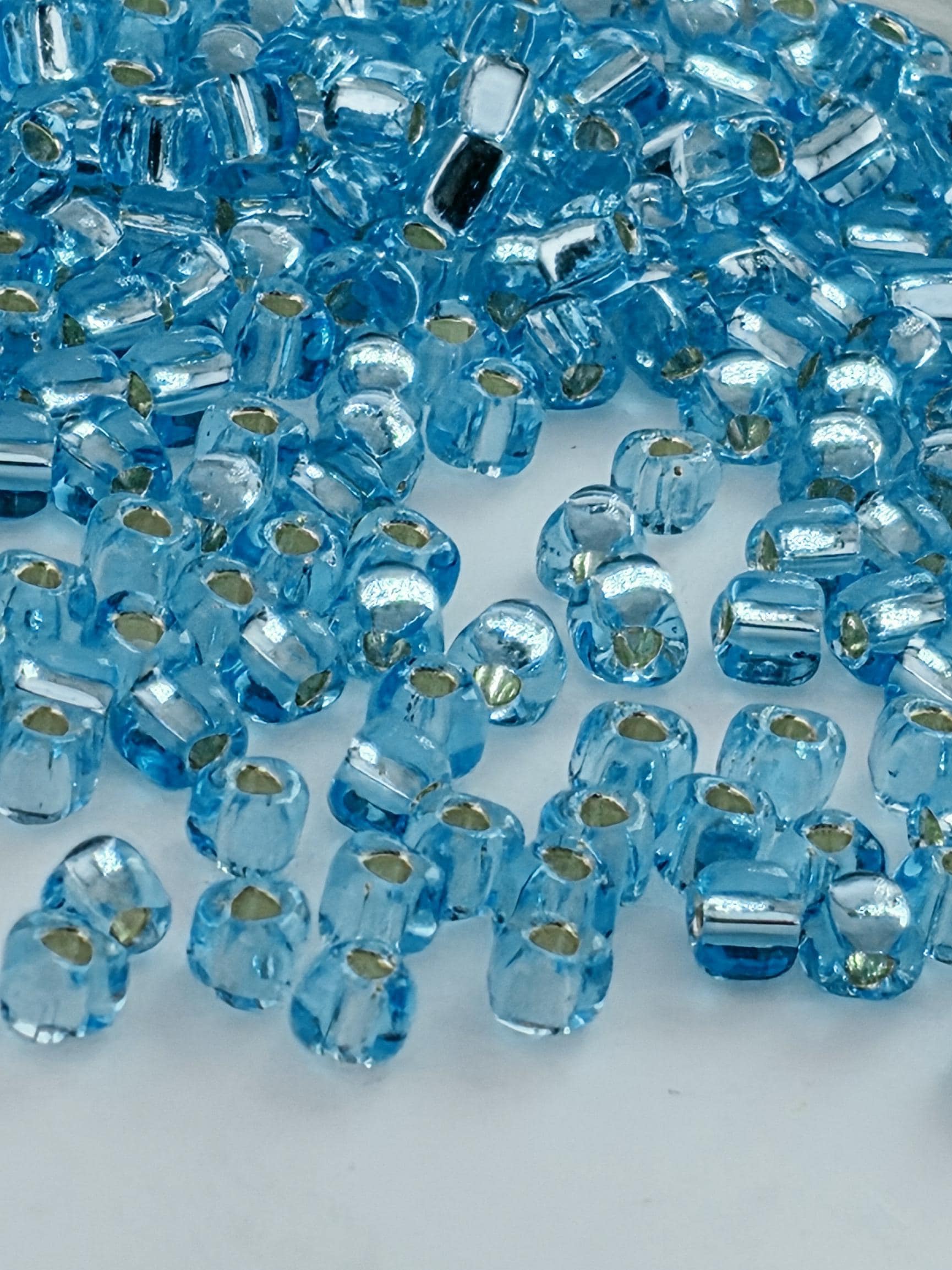 Blue Topaz Translucent Silver Lined Miyuki Triangle Size 8/0 (15g Pkg)