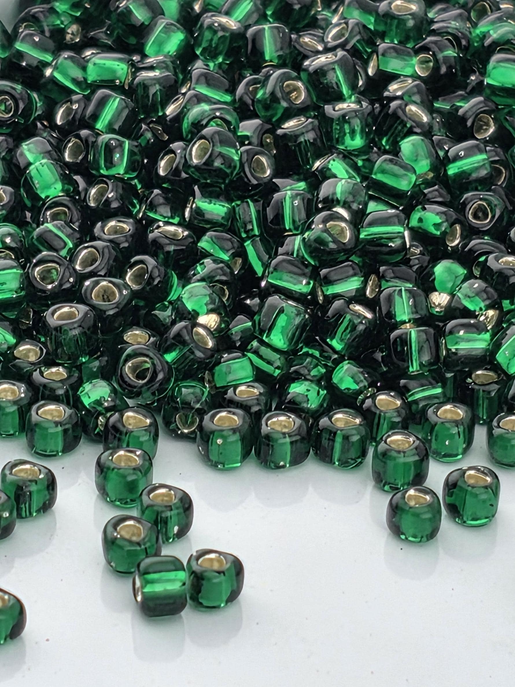 Emerald Green Translucent Silver Lined Miyuki Triangle Size 10/0 (15g Pkg)
