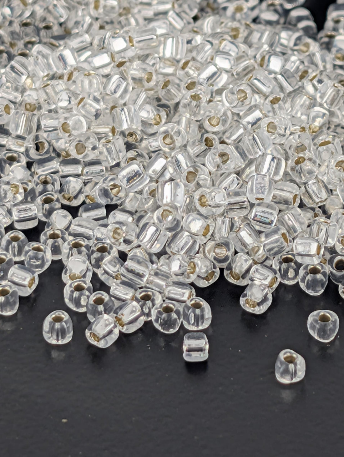 Crystal Translucent Silver Lined Miyuki Triangle Size 10/0 (15g Pkg)