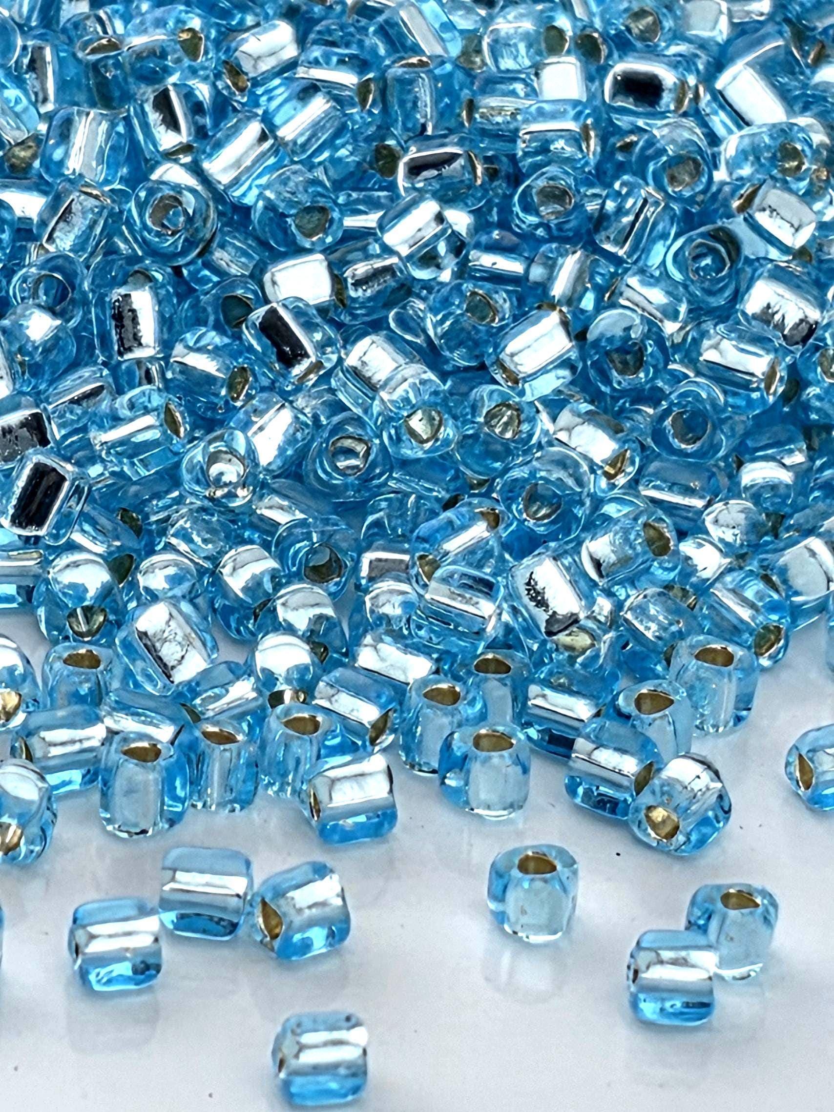 Blue Topaz Translucent Silver Lined Miyuki Triangle Size 10/0 (15g Pkg)