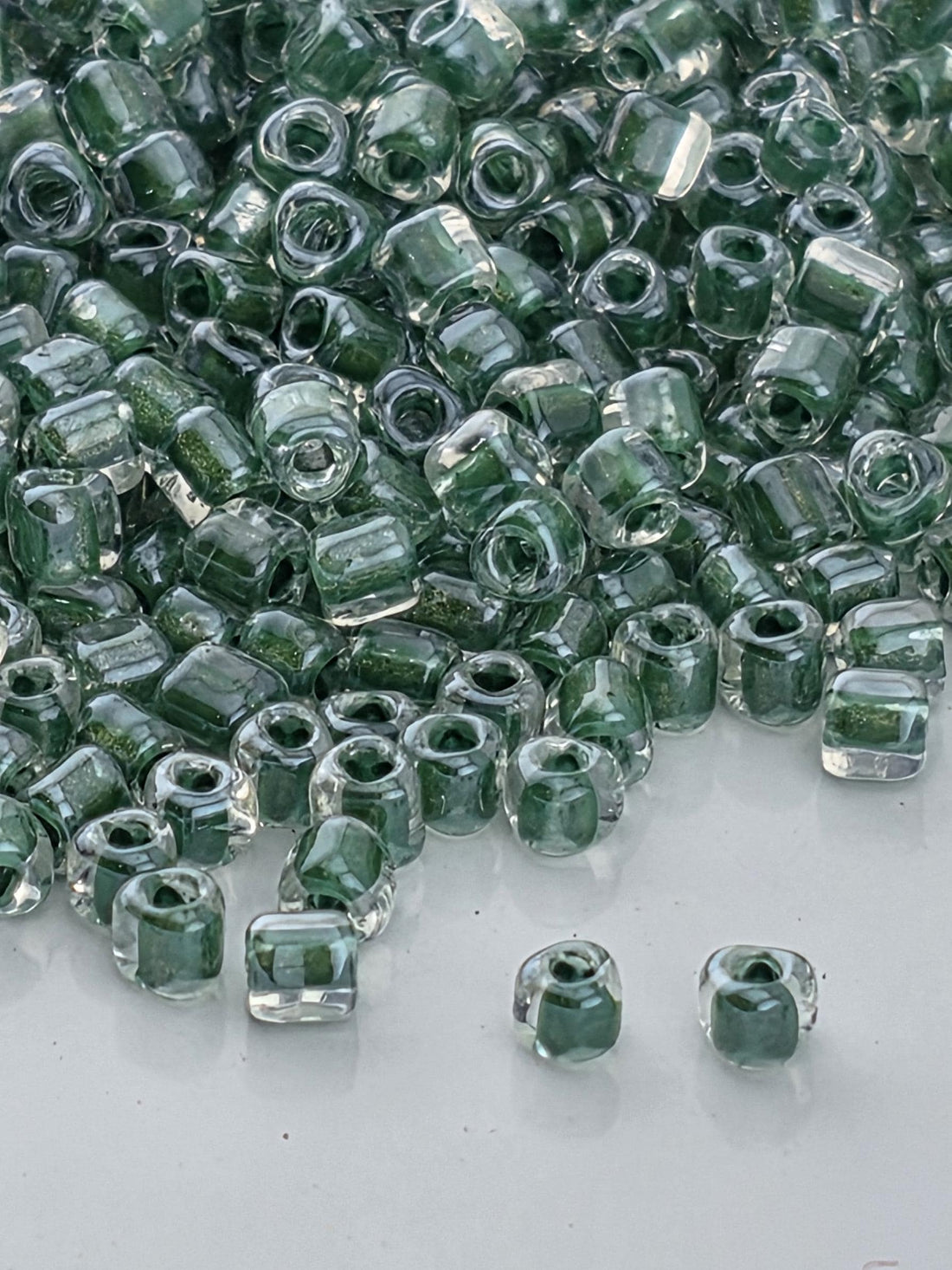 Crystal/Hunter Green Inside Color Lined Sparkle Miyuki Triangle Size 10/0 (15g Pkg)