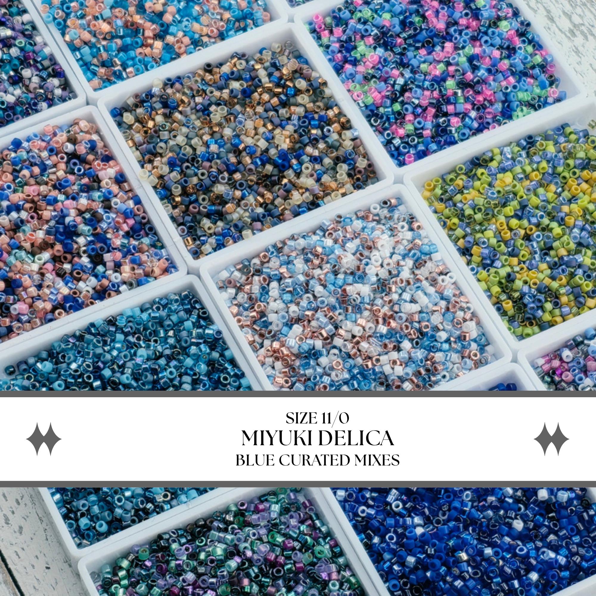 a collection of blue curated mixtures in various sizes, arranged in multiple white containers.