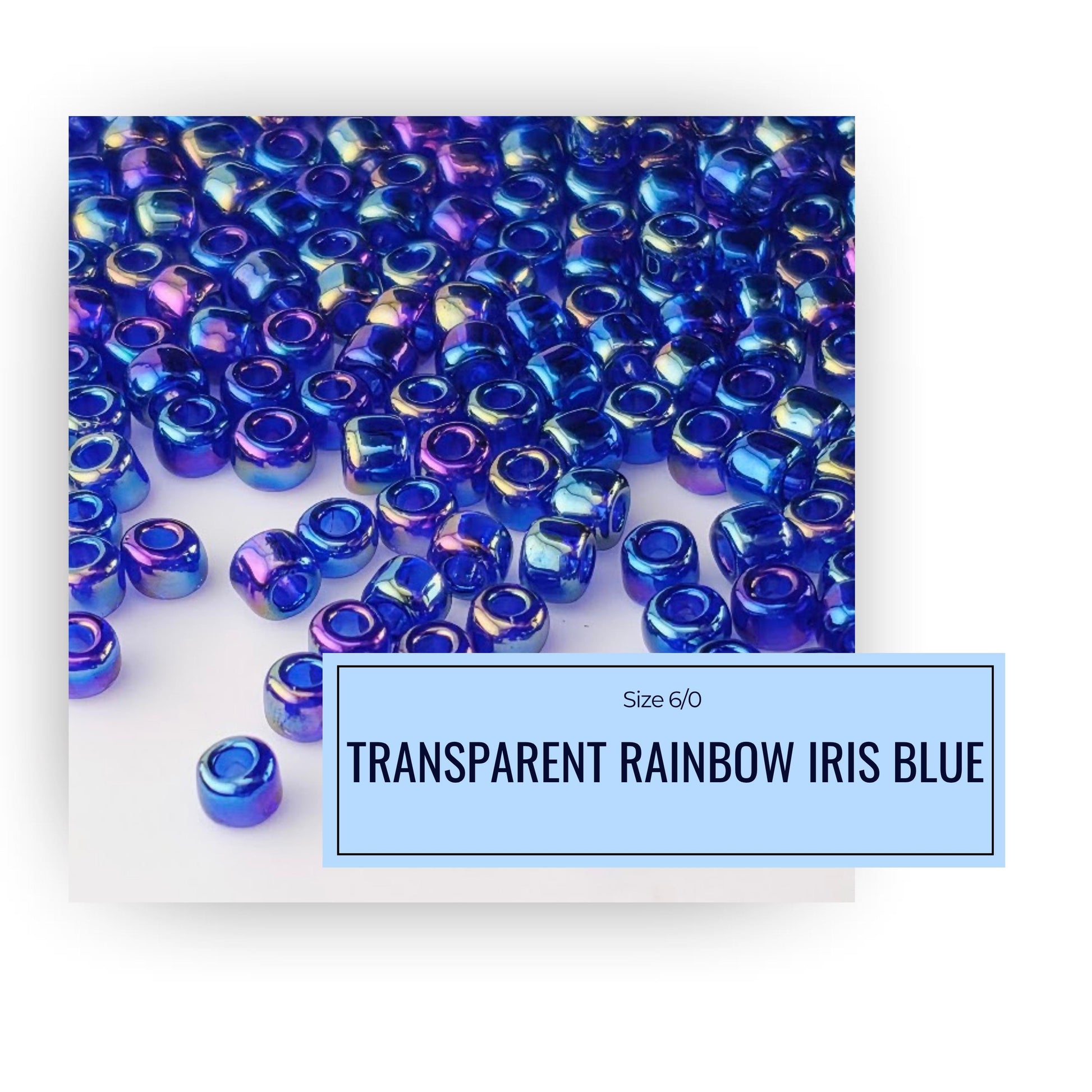 a collection of iridescent blue beads scattered across a white background.