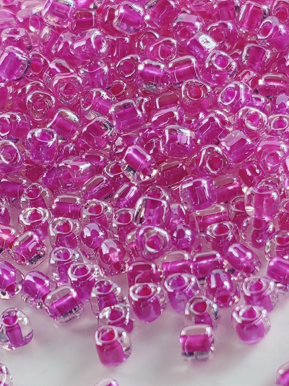 Miyuki Triangle Beads, Crystal/Fuchsia Inside Color Lined | 8/0 Size | 15g Pack