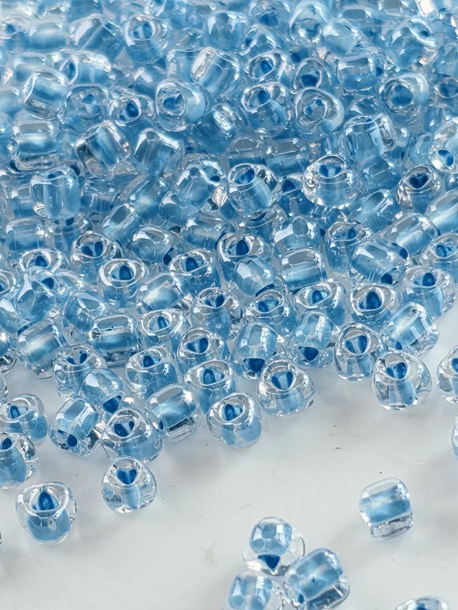 Crystal/Medium Blue Inside Color Lined | Triangle Size 8/0 | Miyuki | 15g Pkg