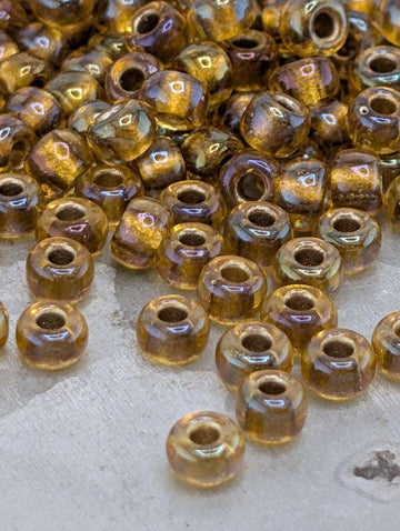 Amber/Amber Inside Color Lined Sparkle Rocaille | 6/0 | Miyuki - 15g pkg