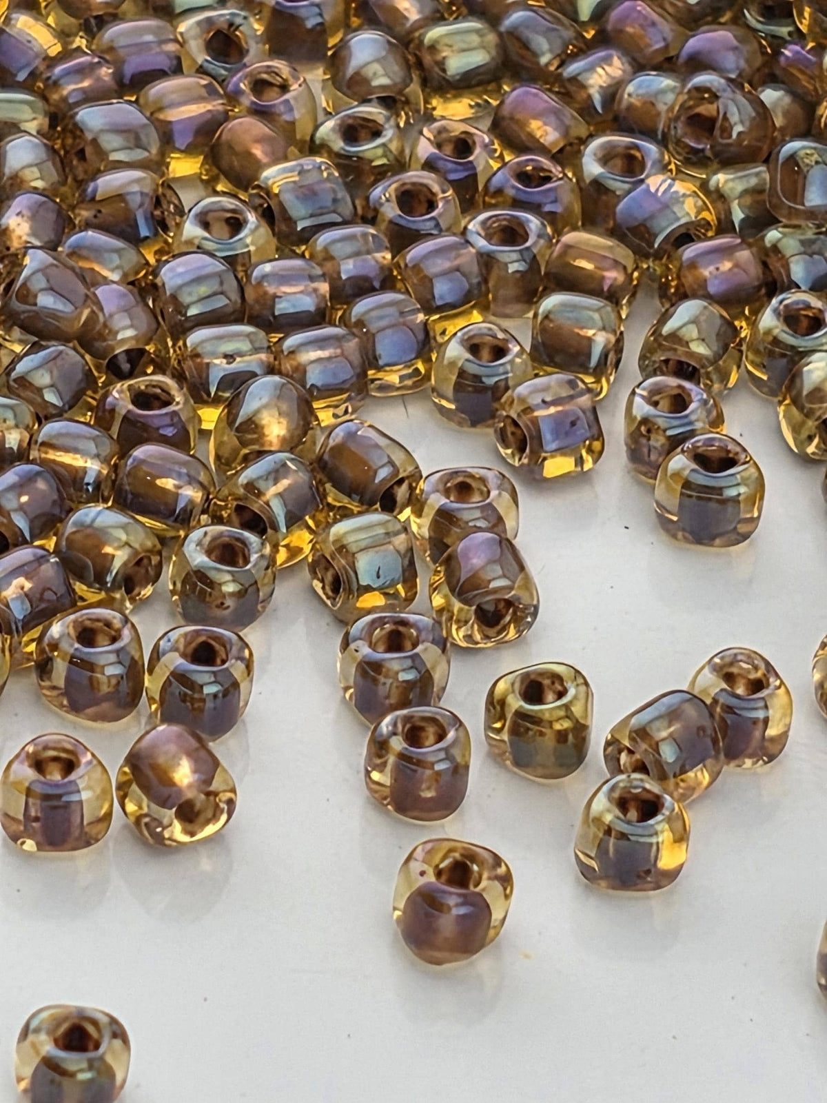 Miyuki Triangle Beads, Amber Brown Inside Color Lined | 10/0 Size | 15g Pack