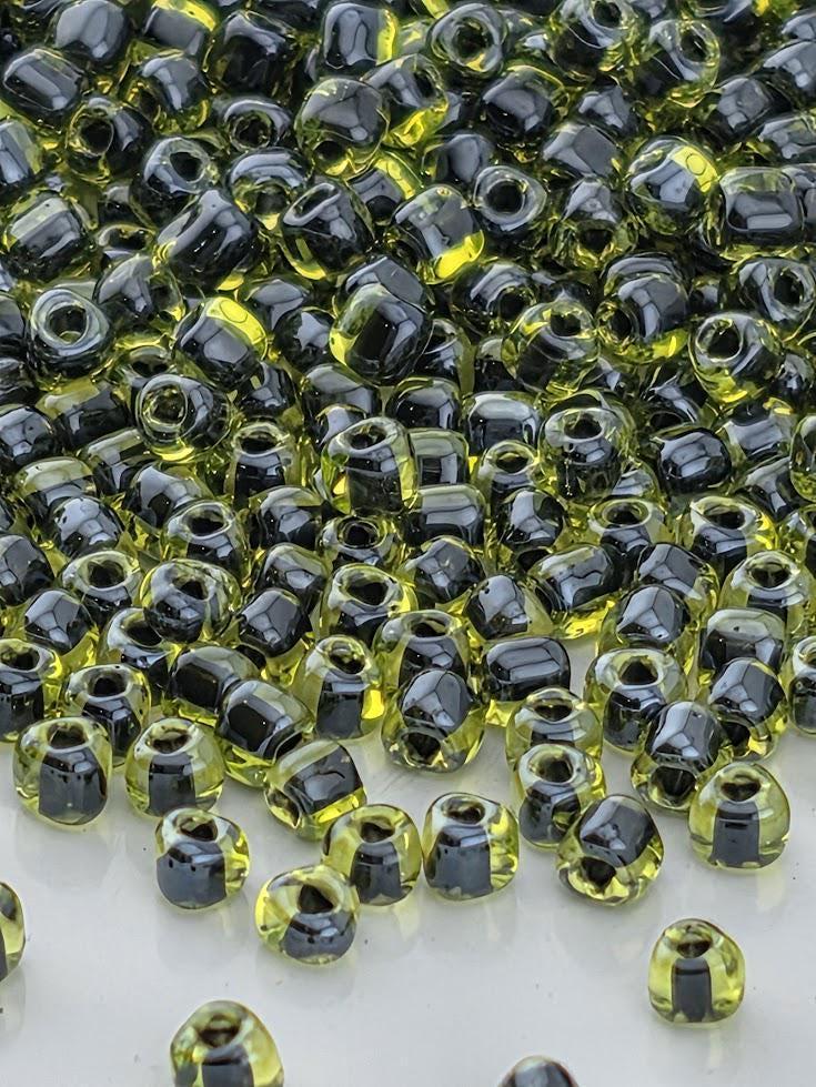 Peridot/Black Inside Color Lined | Triangle Size 10/0 | Miyuki | 15g Pkg