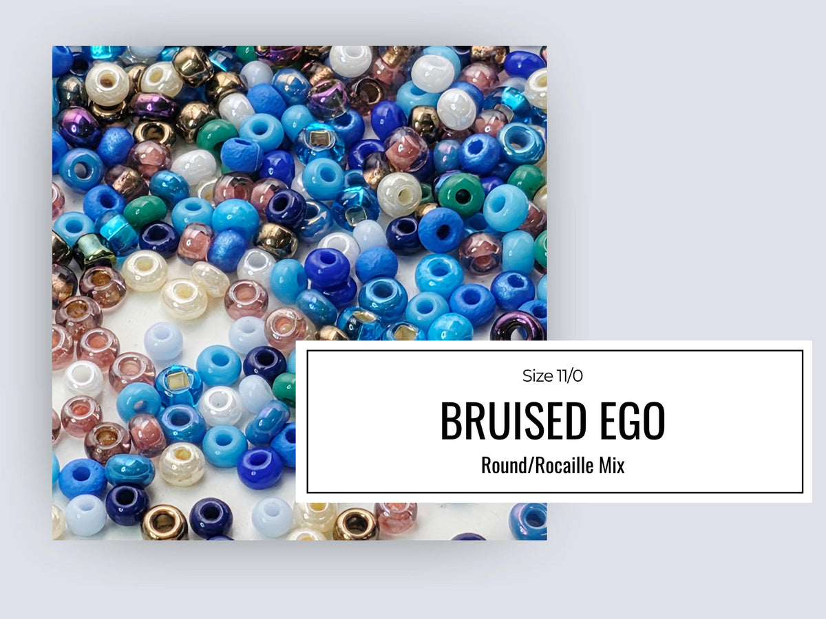 The image is a collage of various colored beads, including blue, white, and multicolored beads, arranged in a visually appealing manner.