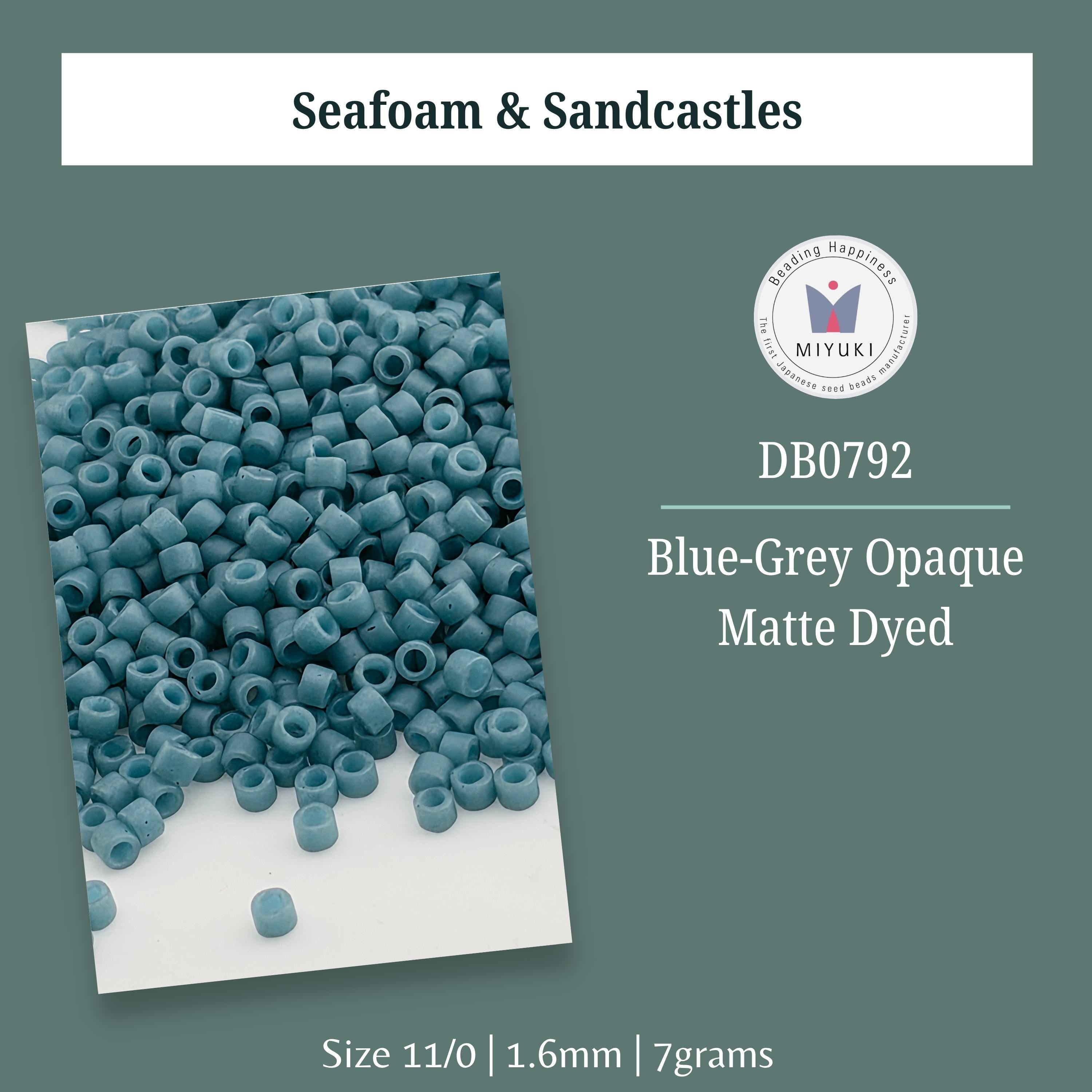 a pile of blue-grey opaques, which are small, round, and blue-grey in color. The image also includes a small piece of the opaques. The text provides information about the product, including its size, material, and manufacturer.