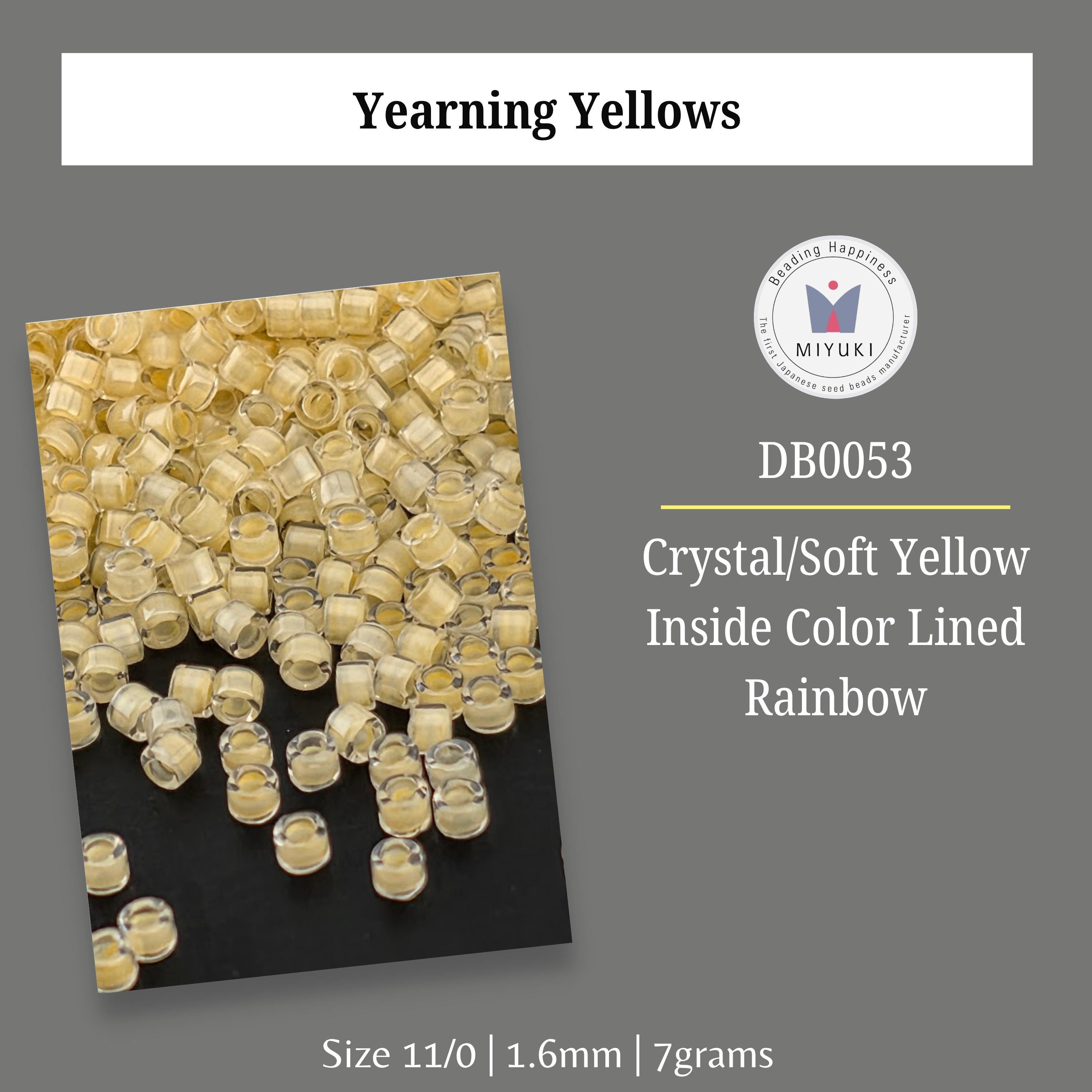 a collection of small, clear beads in various colors, including yellow and orange, arranged in a visually appealing manner.