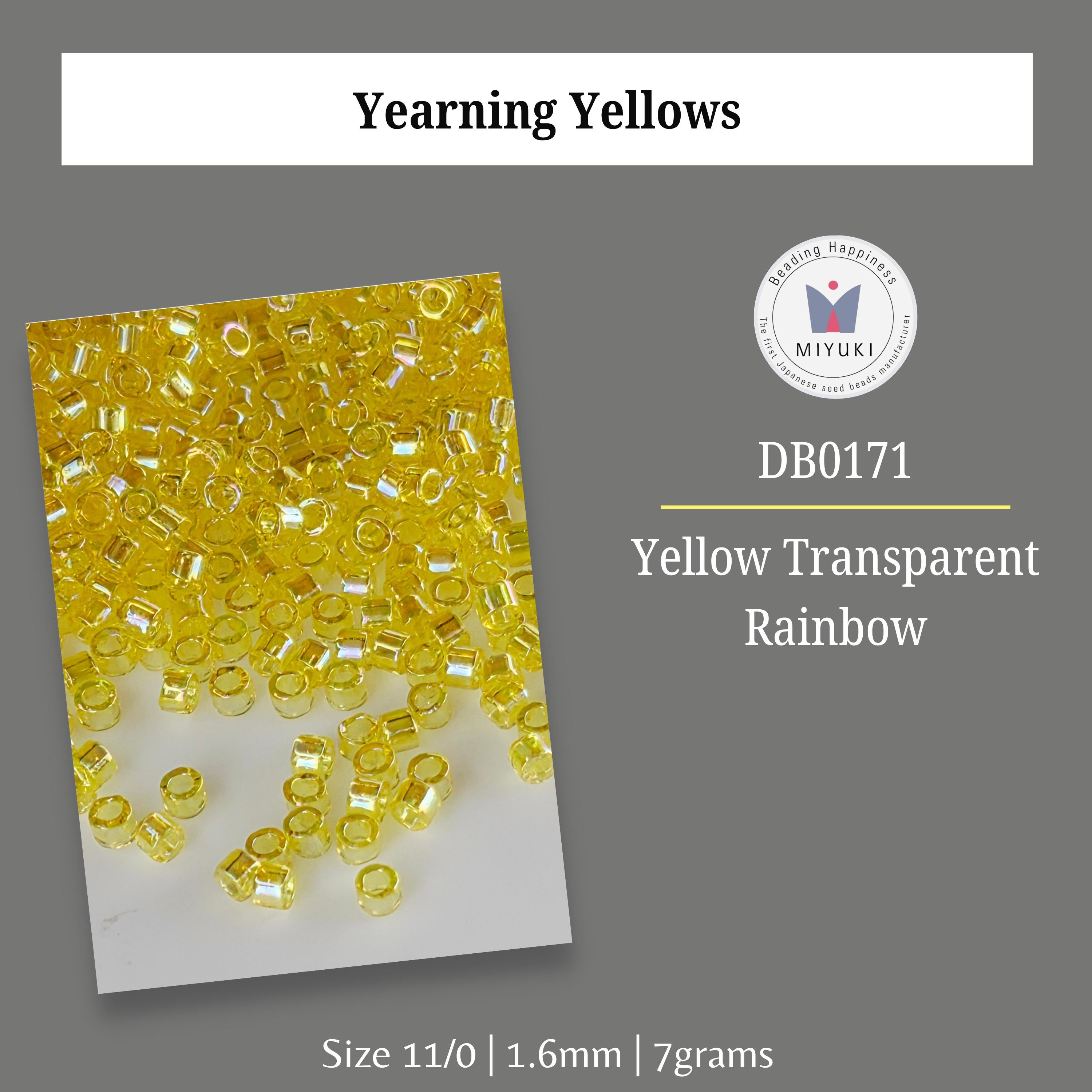 a collection of yellow transparent beads, specifically yellow transparent rainbow beads, arranged in a visually appealing manner.