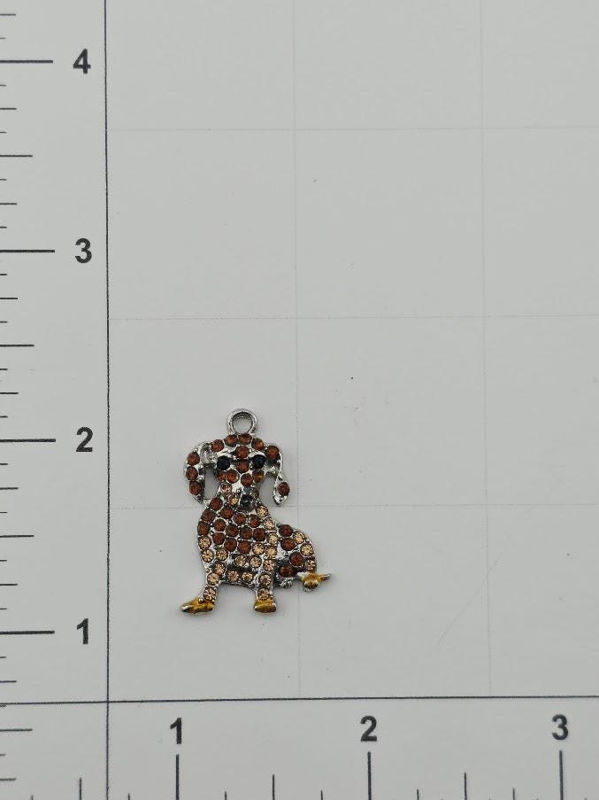 a small charm in the shape of a dog, made of colorful beads or stones.