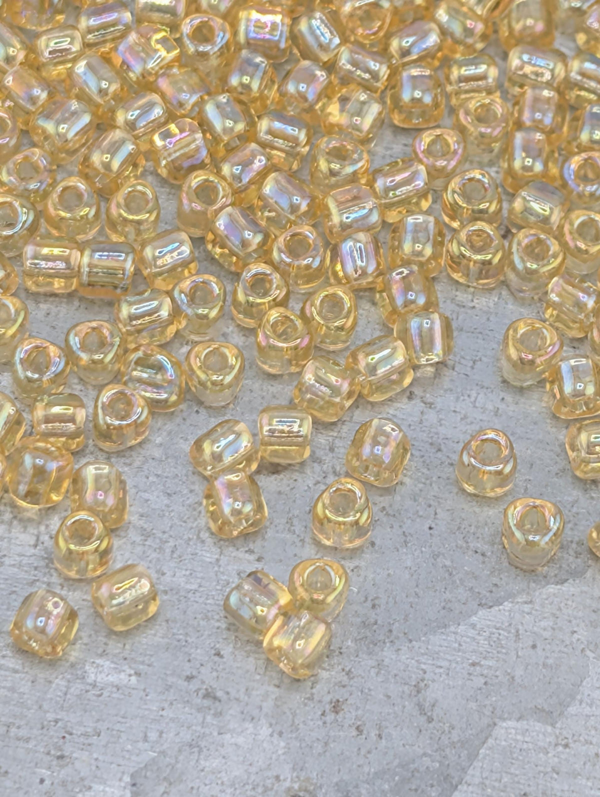 Miyuki Triangle Beads, Light Gold Translucent Rainbow | Size 10/0 | 15g Pack