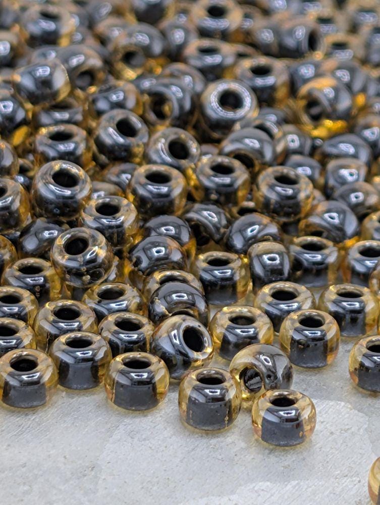 Amber/Black Inside Color Lined Rocaille | 6/0 | Miyuki - 15g pkg