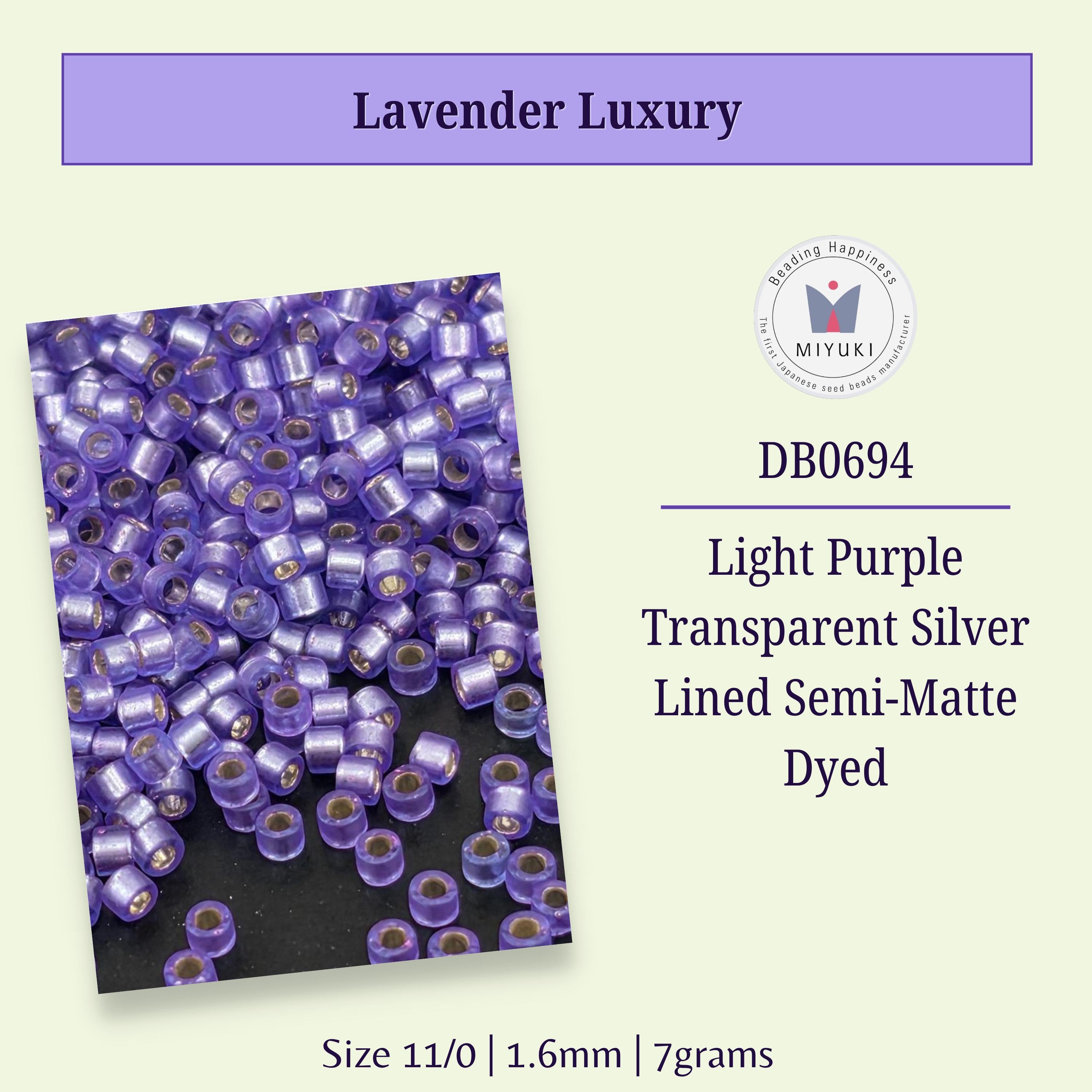a collection of purple beads, specifically beads in the color lavender, arranged in a visually appealing manner.