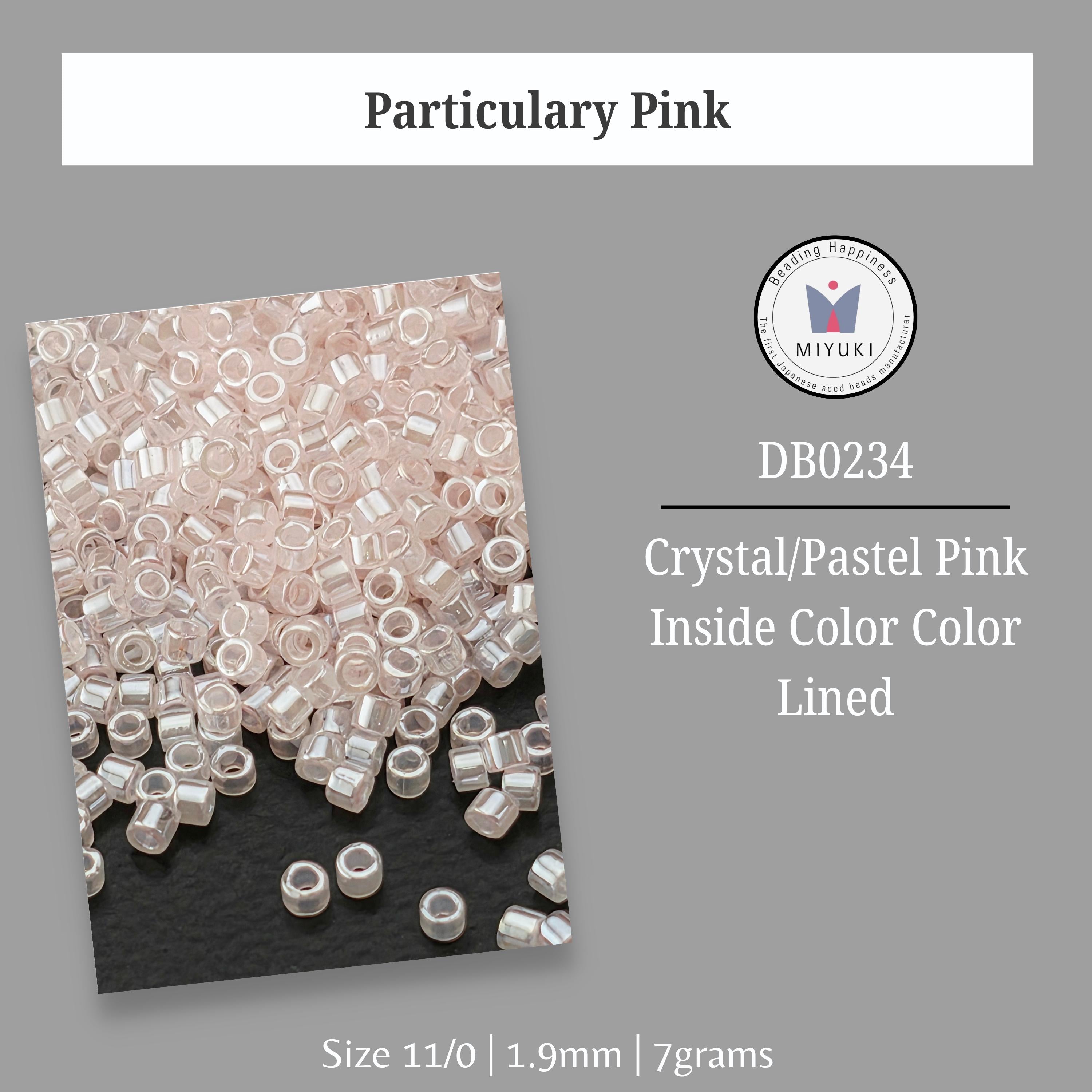 a collection of clear beads in various sizes, including 11/0, 1.9mm, and 7 grams, arranged on a black background.