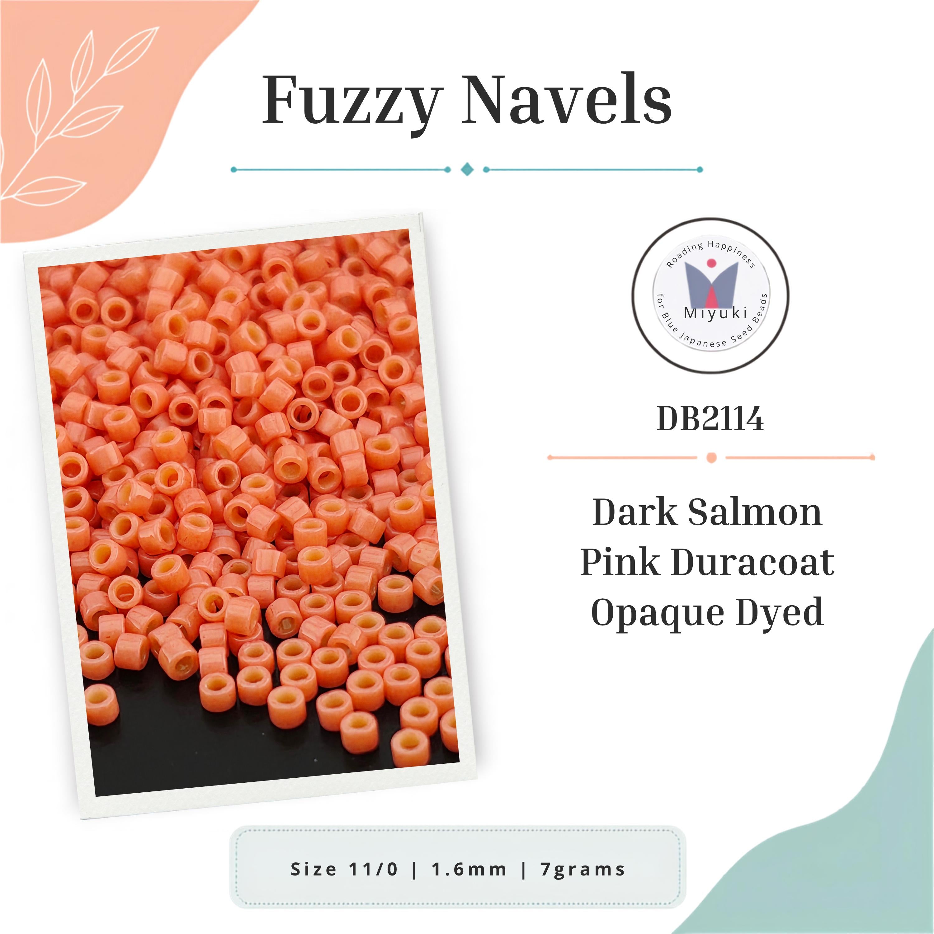a collection of orange beads, specifically fuzzy navel beads, arranged in a visually appealing manner.