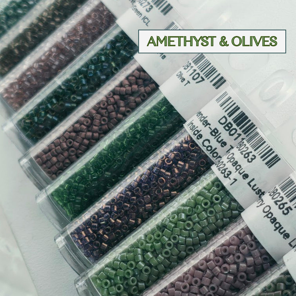 A collection of clear plastic containers filled with various colored beads, including amethyst and olive beads, arranged in rows.