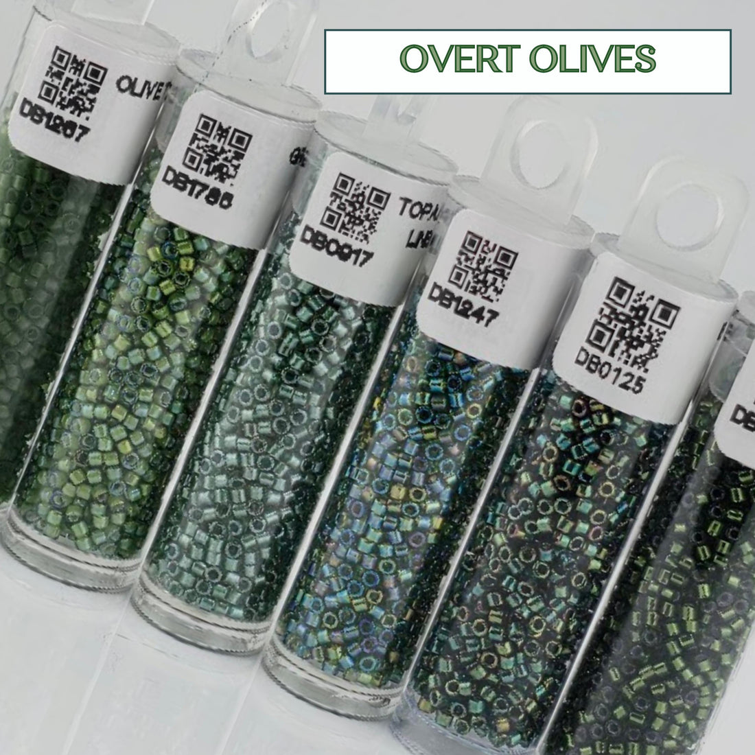 a collection of green and black beads in glass containers, with each container labeled with a barcode and a QR code.