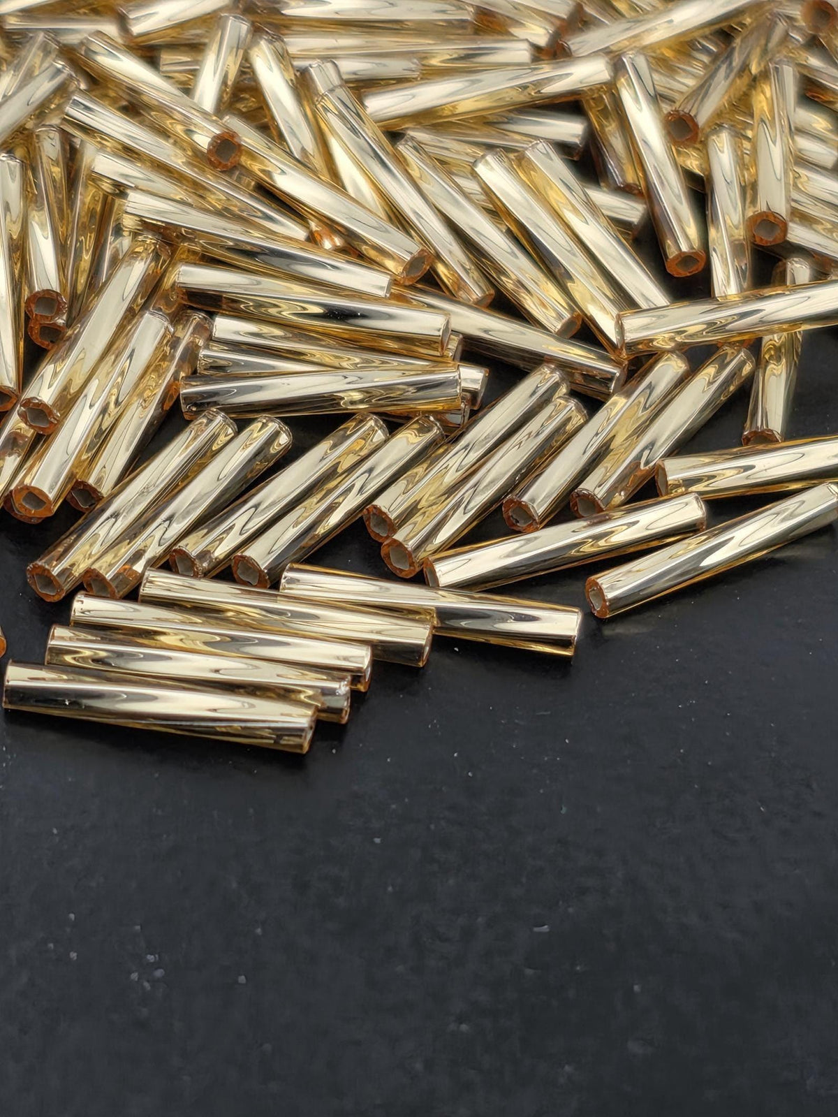 Miyuki Twisted Bugles 2x12 Gold Translucent Silver-Lined Size 2x12mm