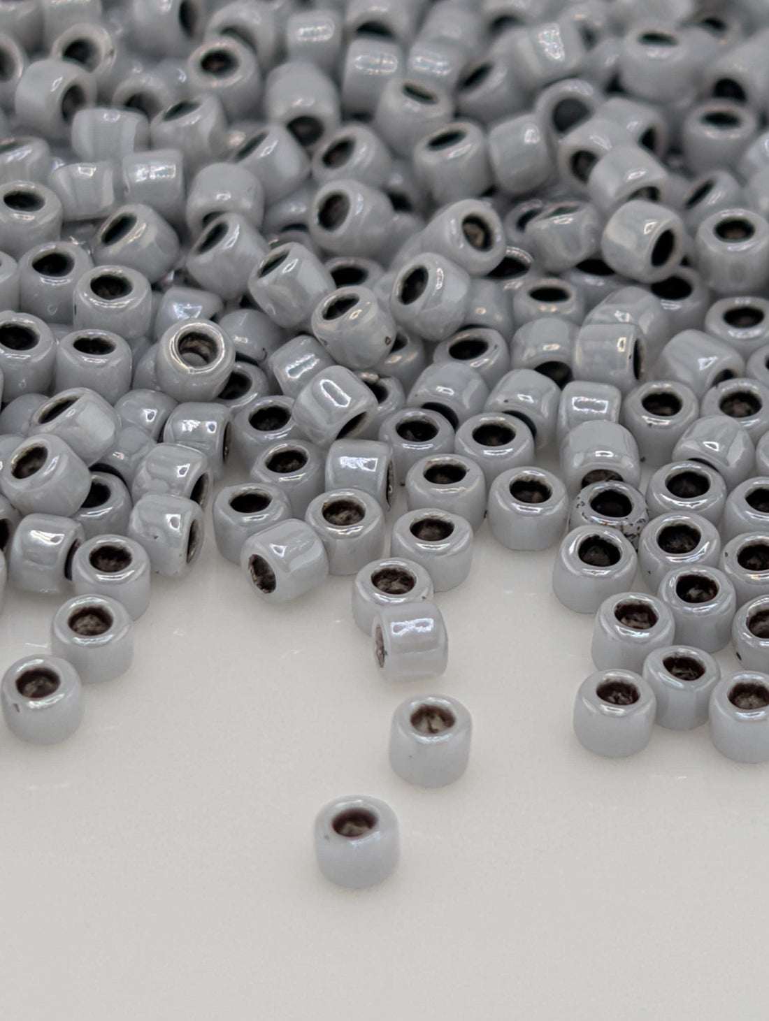 Toho Round Beads, Opaque Gray/Black-Line | 15/0 | 8g Pack