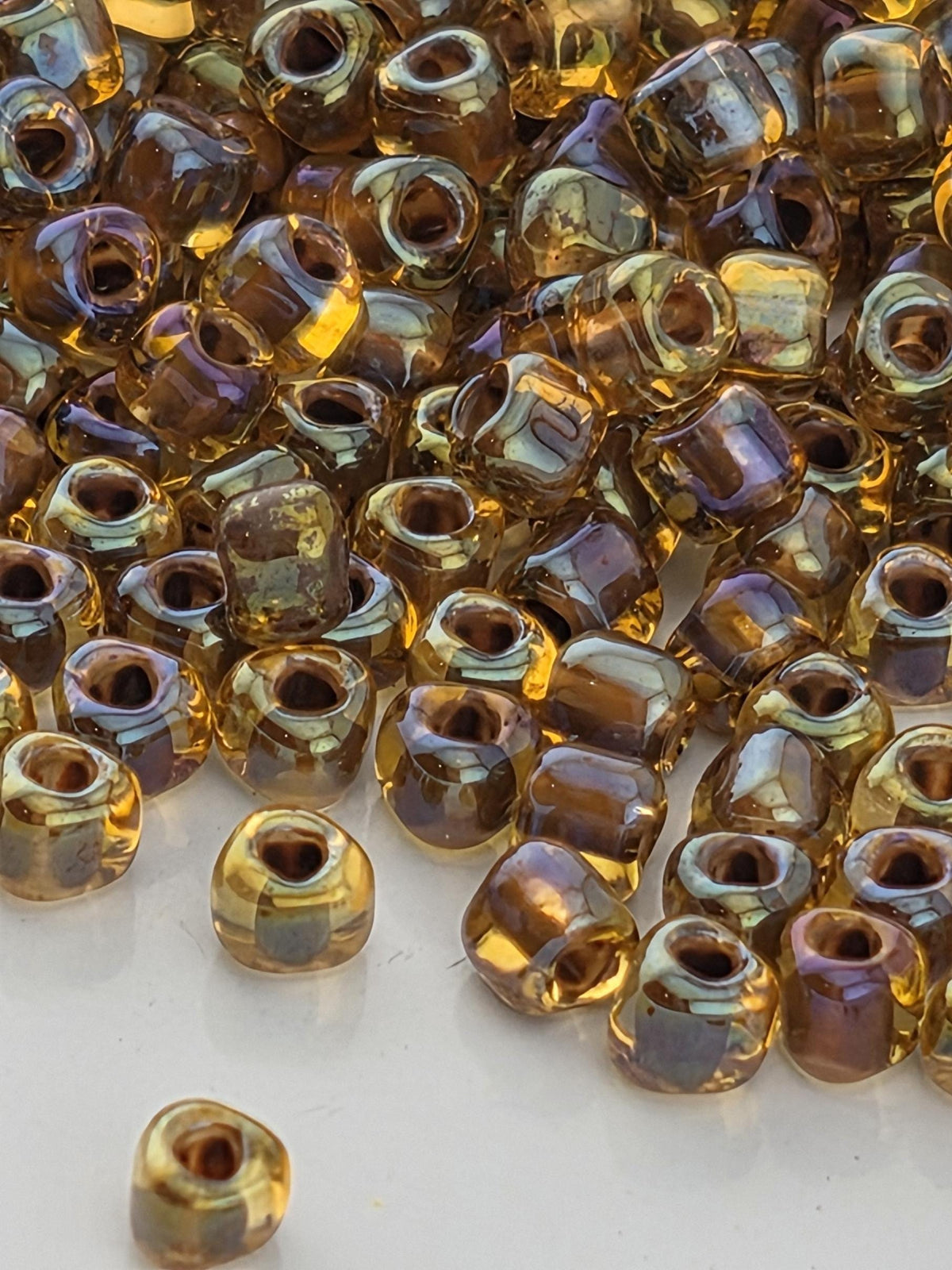Miyuki Triangle Beads, Amber Brown Inside Color Lined | 8/0 Size | 15g Pack