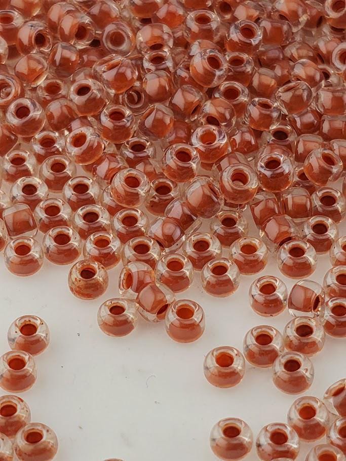 Crystal/Burnt Orange Inside Color Lined Rocaille | 8/0 | Miyuki - 15g pkg