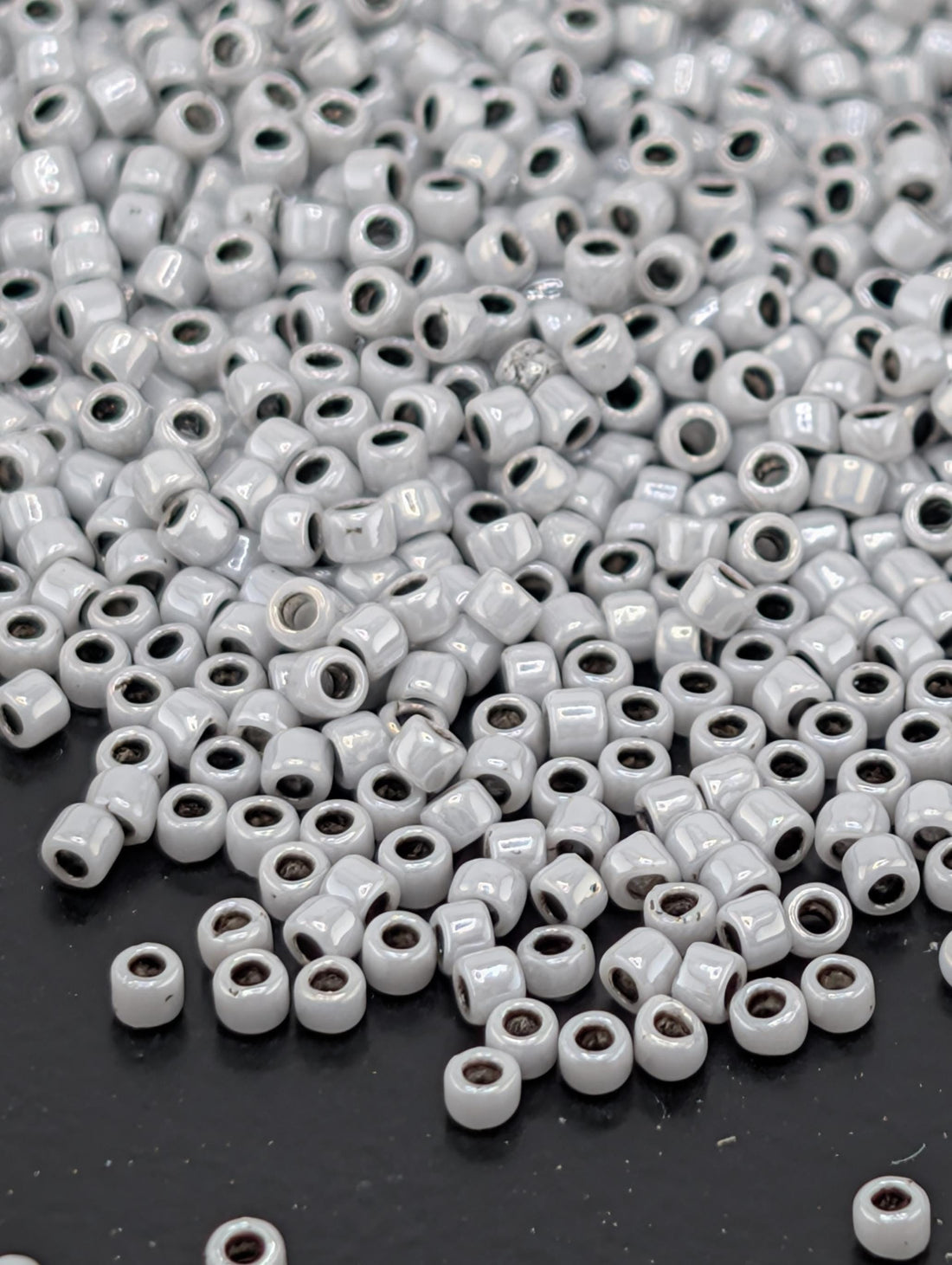 Toho Round Beads, Opaque Gray/Black-Line | 15/0 | 8g Pack