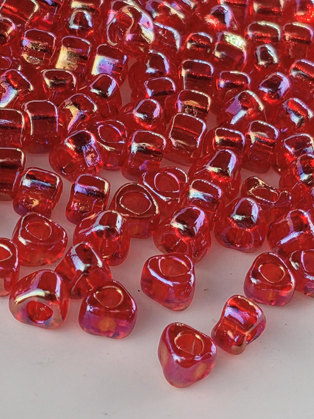 Miyuki Triangle Beads, Berry Red Translucent Rainbow | 5/0 | 15g Pack