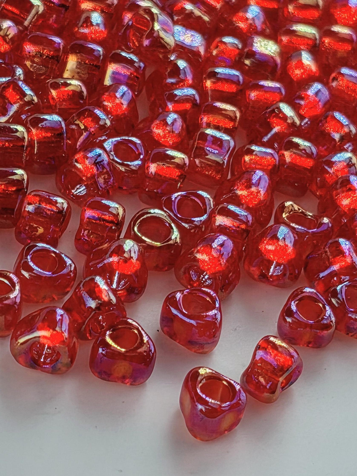 Miyuki Triangle Beads, Berry Red Translucent Rainbow | 5/0 | 15g Pack